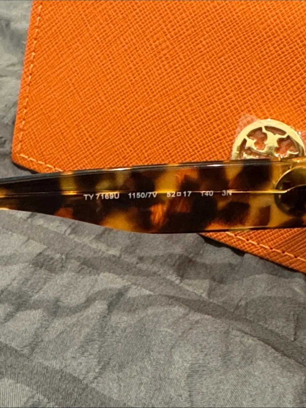 Tory Burch Tortoiseshell Sunglasses with Blue-Purple Lenses